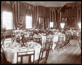 Interior view of a banquet room set for a dinner in honour of Prince Louis of Battenberg